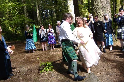 Sara and Ian jumping the besom at the Hermitage