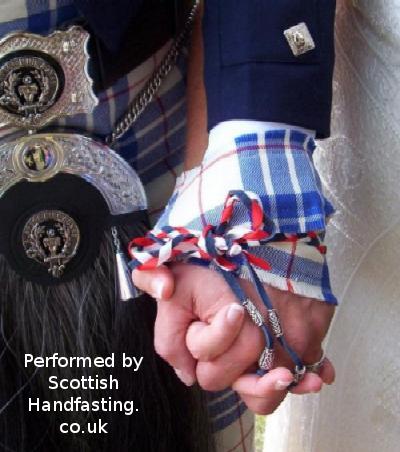 Handfasting at a wedding. Copyright.