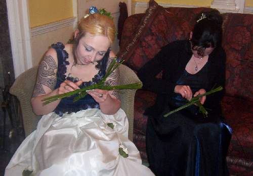 Bride and Maid making 
Cross as part of reception Entertainment